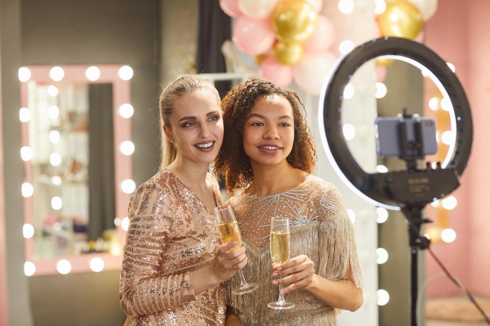 beautiful women posing for photo by ring light